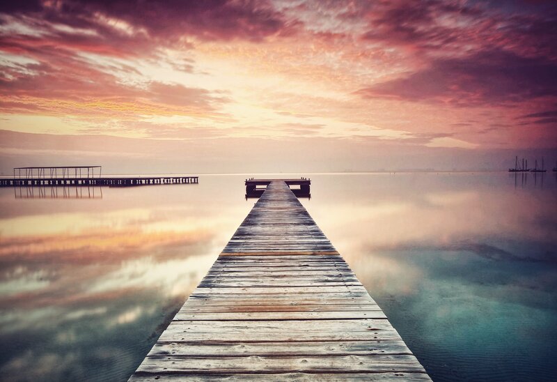 Wooden pier at sunset