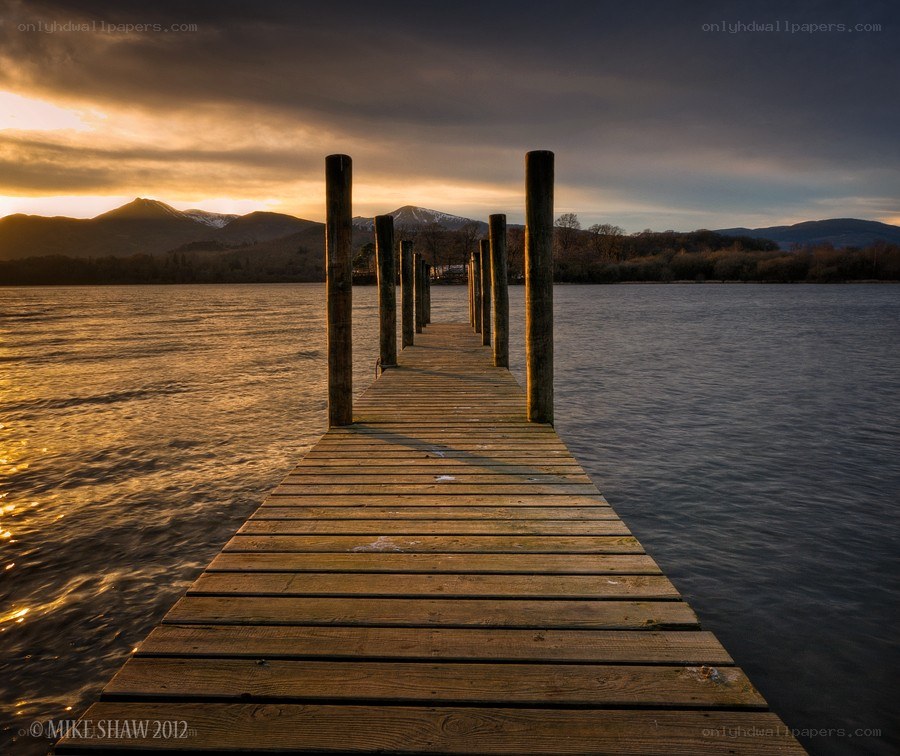 Wooden pier at sunset