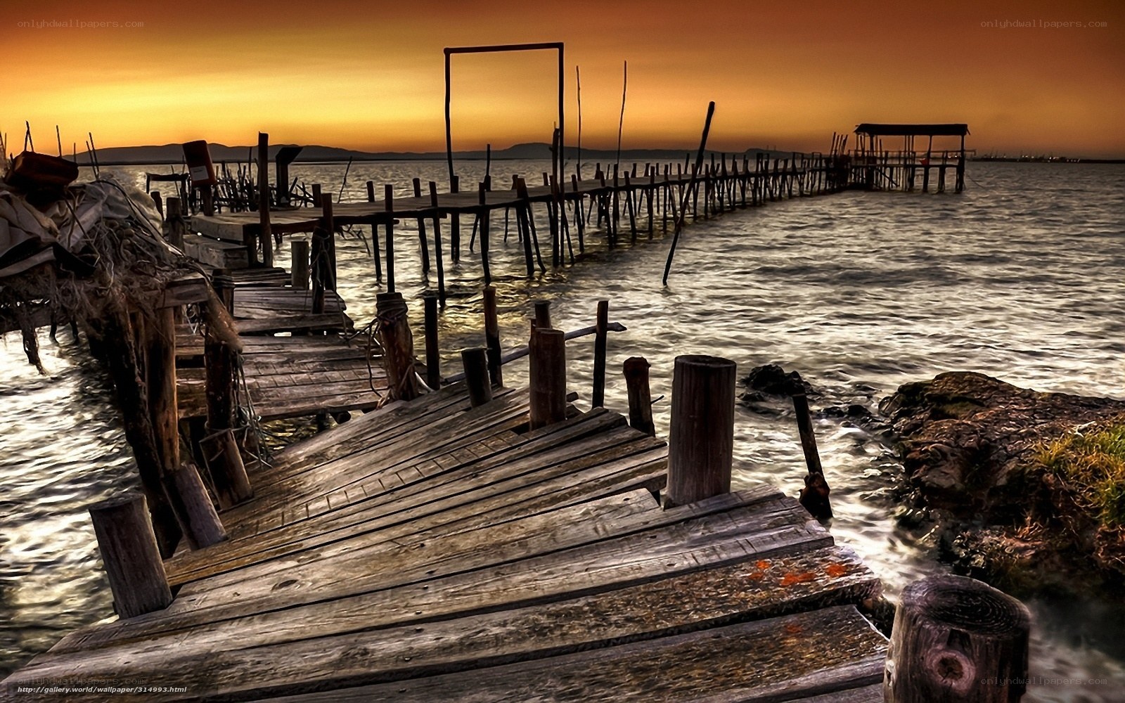 Wooden pier at sunset