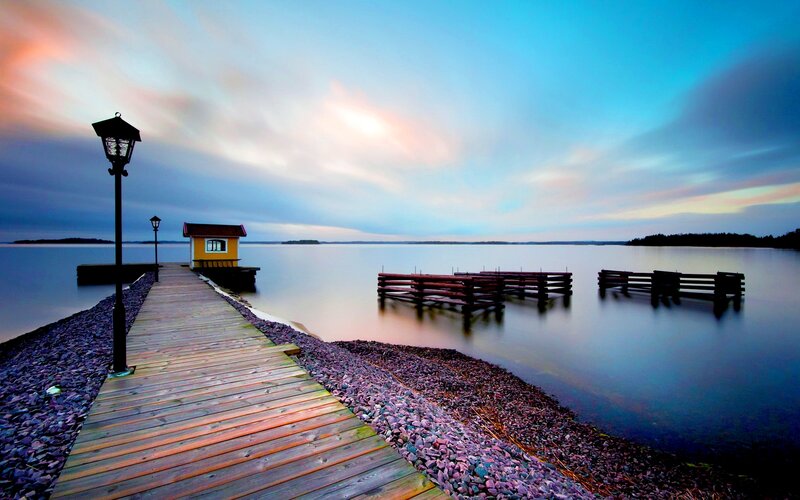Wooden Pier at Sunset — Blue, Serene, Photograph, Lamp Post, Small Building