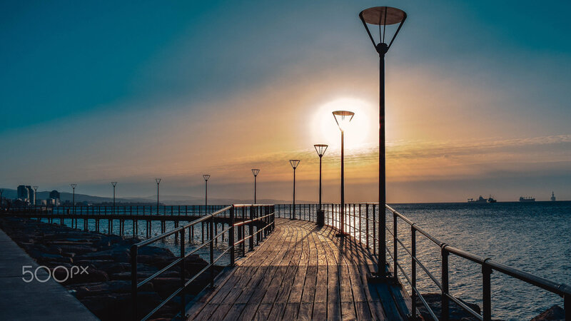 Wooden Pier at Sunset — Blue, Serene, Photograph, Lamps