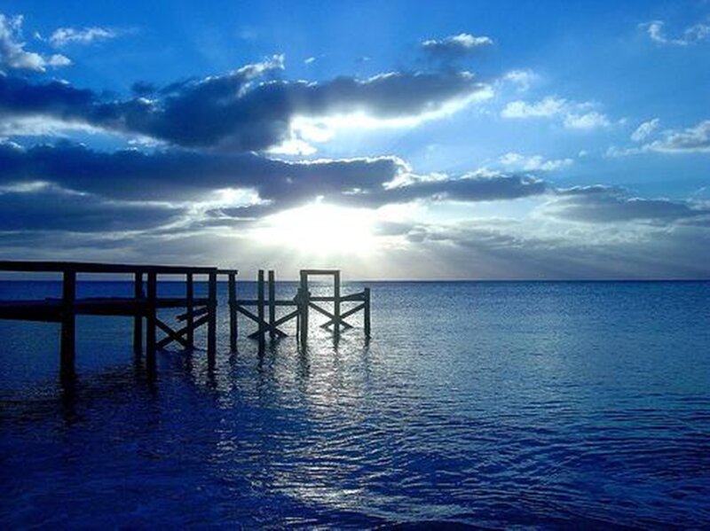 Wooden Pier at Sunset — Blue, Serene, Photograph, Sun, Clouds