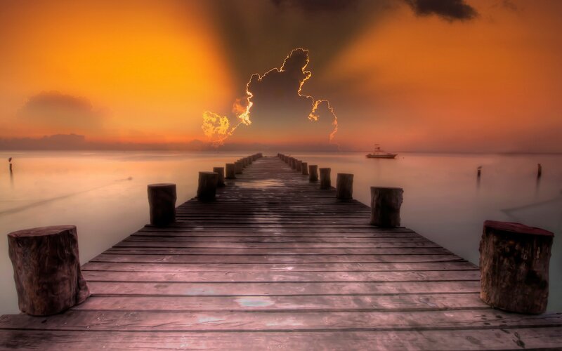 Wooden Pier at Sunset — Orange, Dramatic, Photograph, Lightning, Boat
