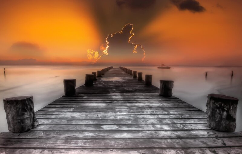 Wooden Pier at Sunset — Orange, Dramatic, Photograph, Lightning