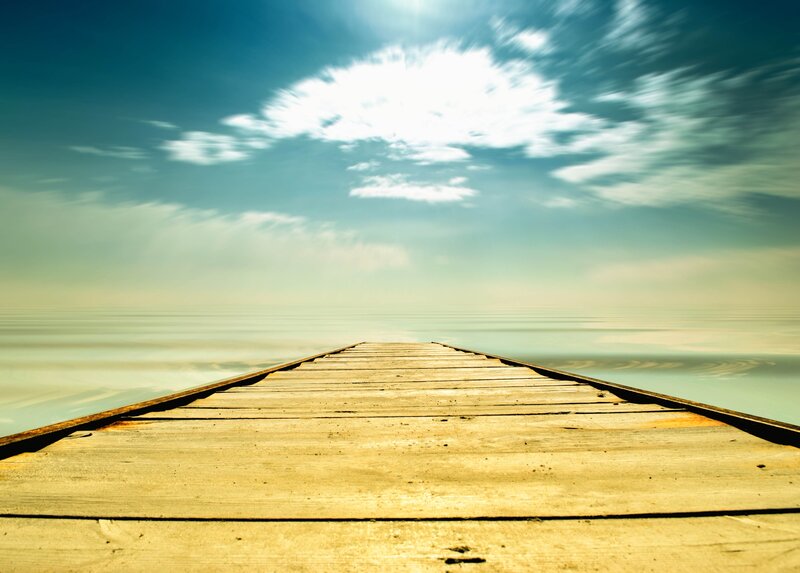 Wooden pier extending into calm sea