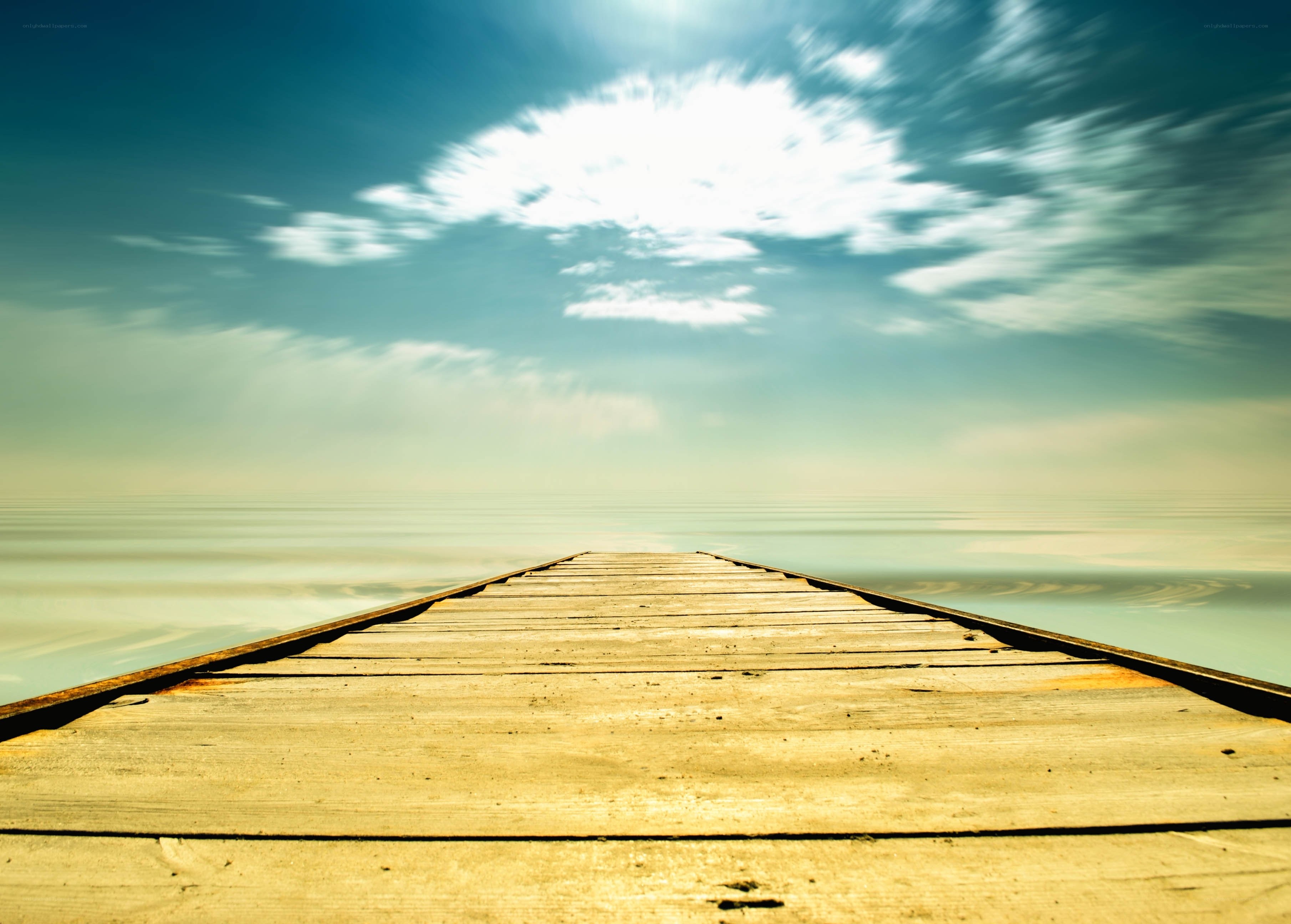 Wooden pier extending into calm sea