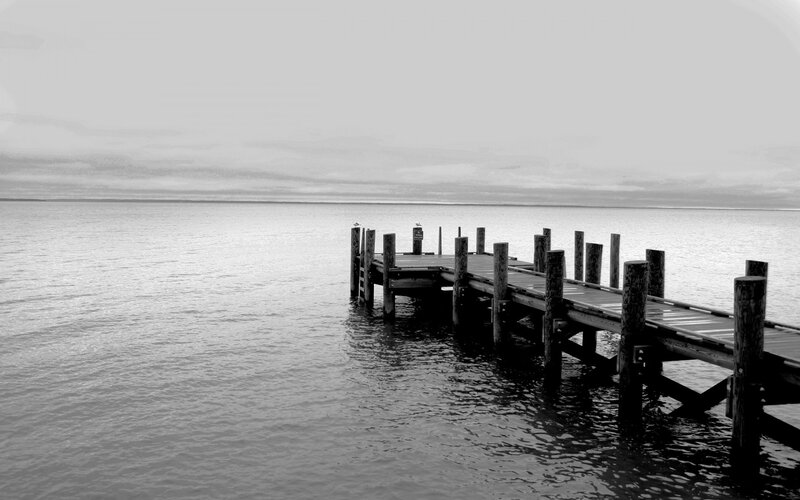 Wooden pier extending into calm water