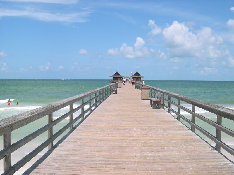 Wooden Pier Extending into Ocean — Blue, Serene