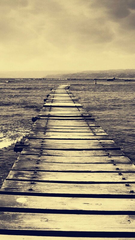 Wooden Pier Extending into Sea — Sepia