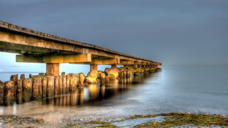 Wooden Pier Extending into Sea