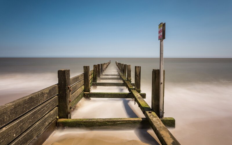 Wooden pier extending into the sea