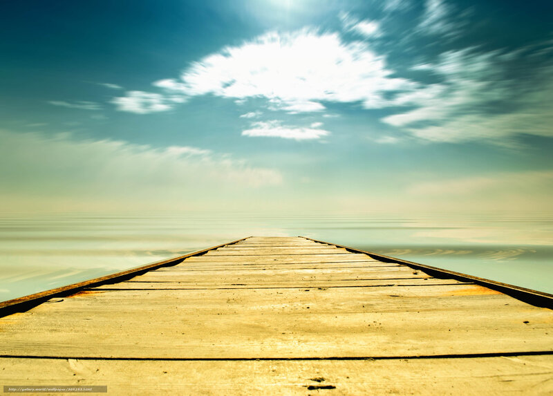 Wooden pier extending to horizon