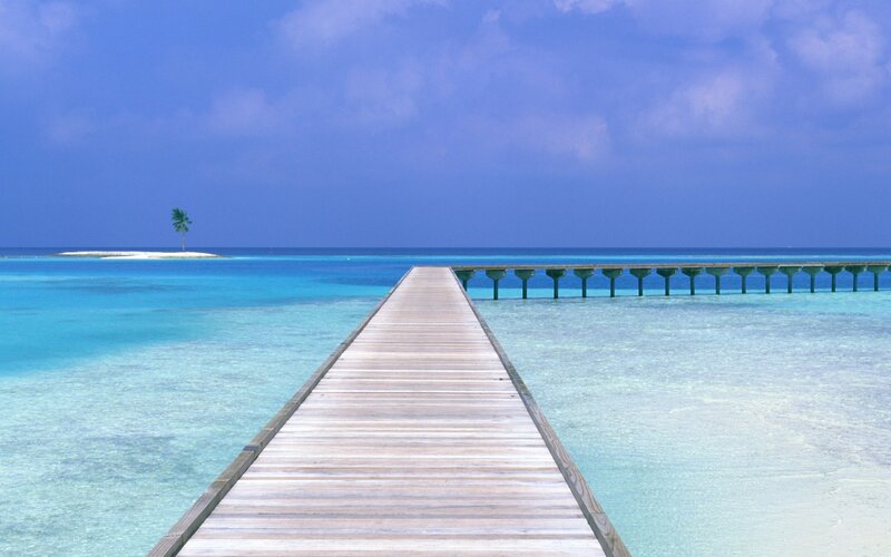 Wooden Pier Extending to Island — Blue