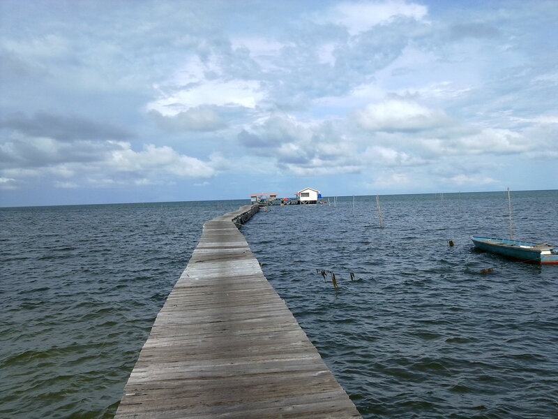 Wooden Pier Extending to Sea