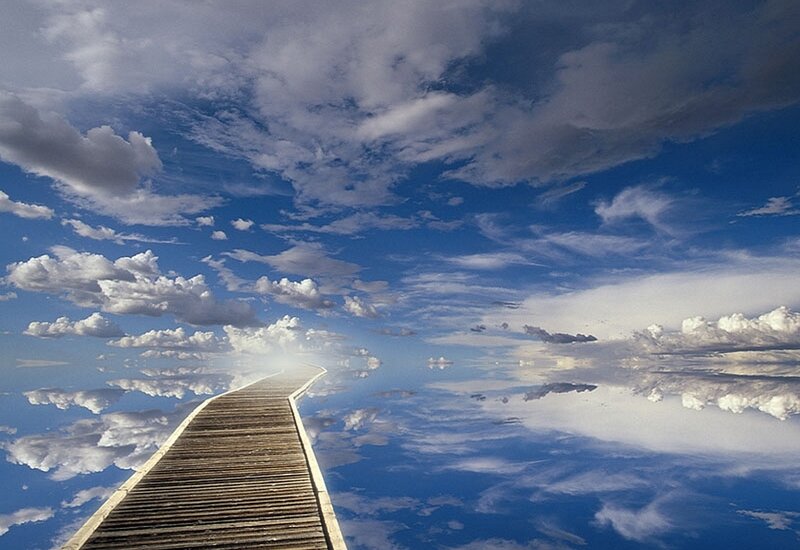 Wooden pier leading to the sky