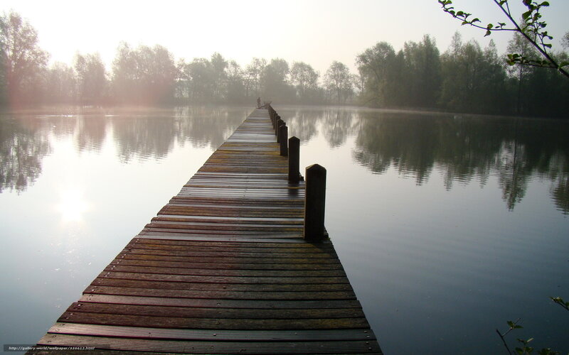 Wooden pier on a misty lake