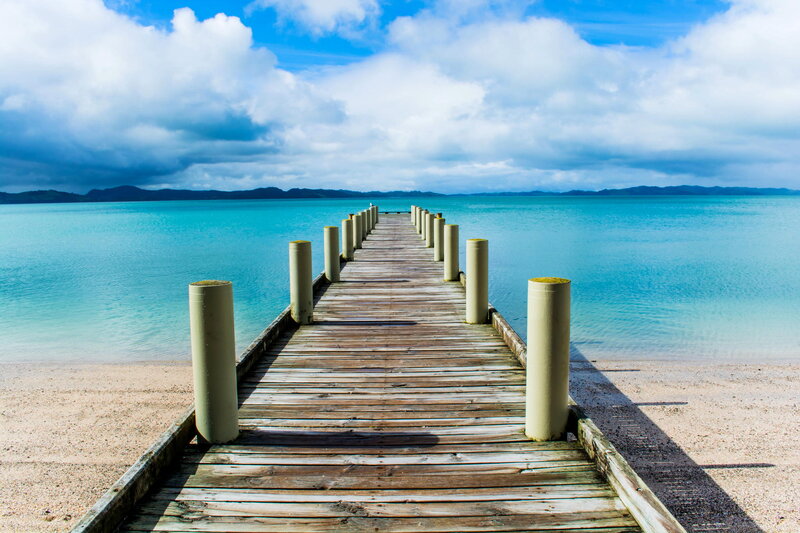 Wooden Pier on Beach — Blue, Serene, Afternoon, Photograph