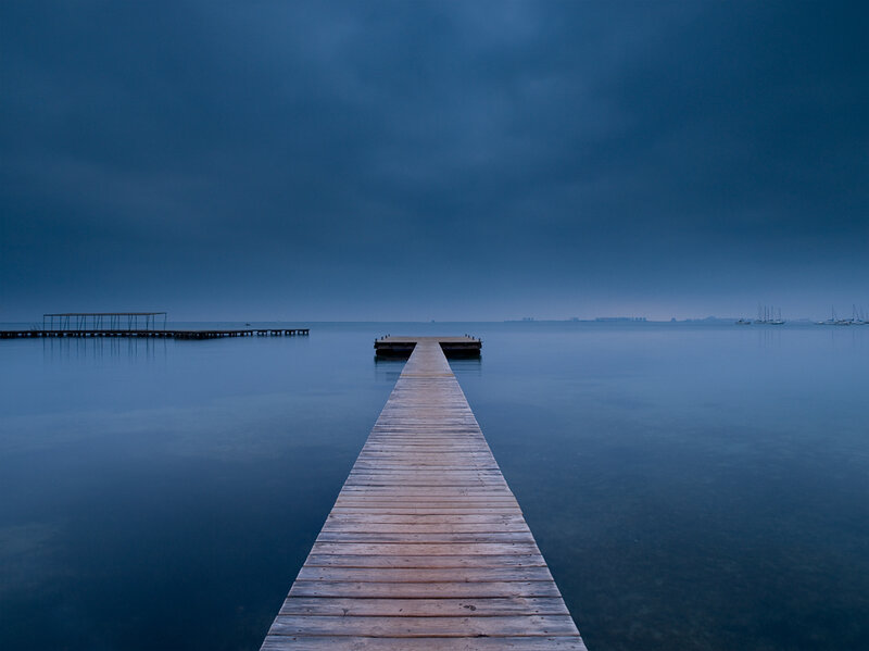 Wooden pier on calm water