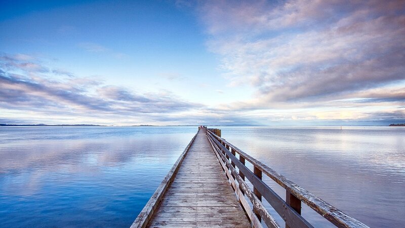 Wooden Pier on Calm Water — Blue, Serene, Morning