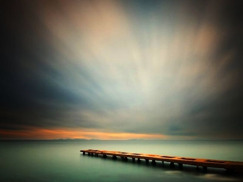 Wooden Pier on Calm Water — Blue
