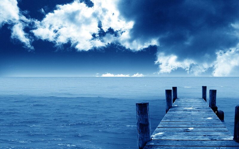 Wooden Pier on Ocean — Blue, Dramatic, Photograph, Clouds