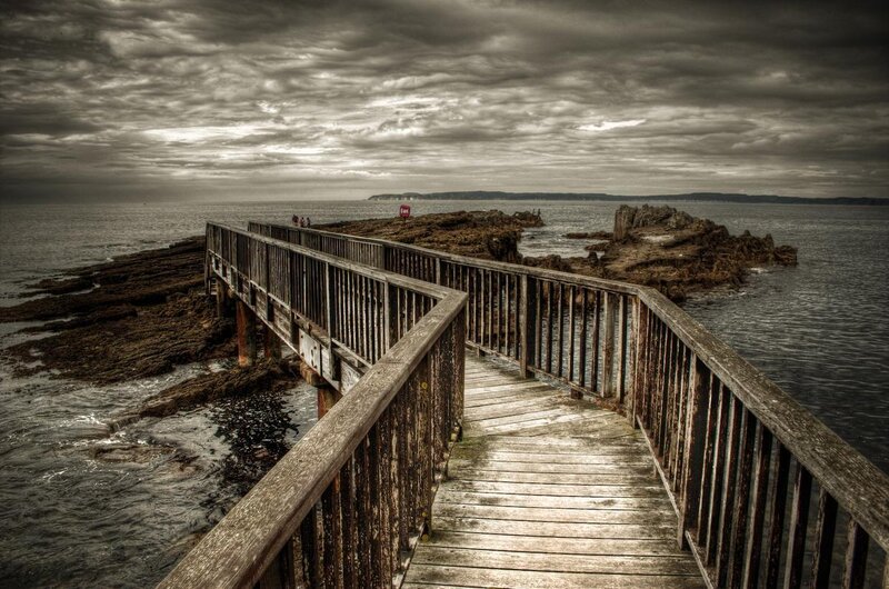 Wooden pier on rocky coast