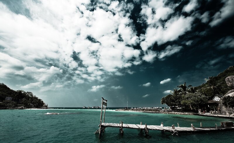 Wooden pier on tropical beach