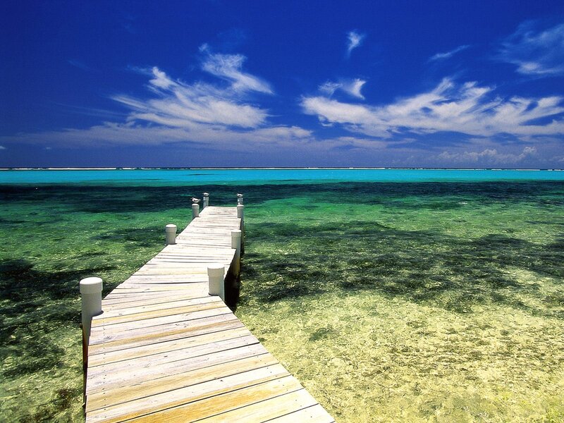 Wooden pier on tropical beach