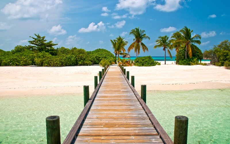 Wooden pier on tropical beach