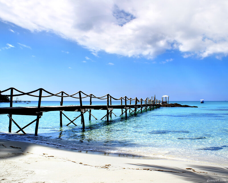 Wooden pier on tropical beach