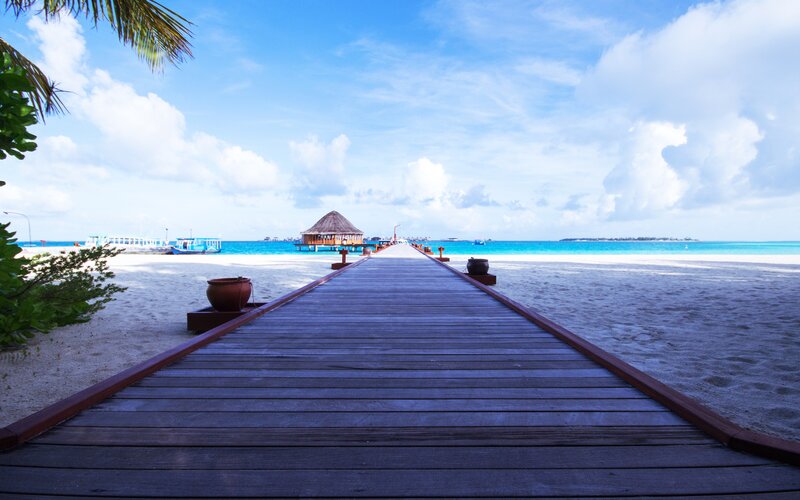 Wooden pier on tropical beach