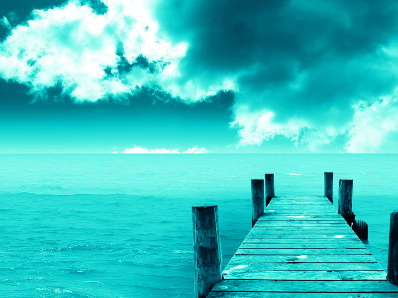 Wooden pier over turquoise sea