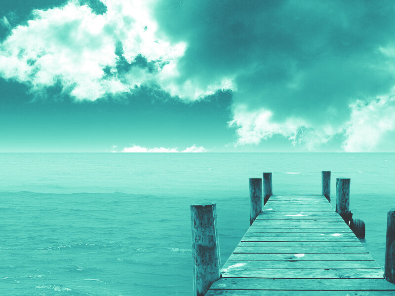 Wooden pier over turquoise sea