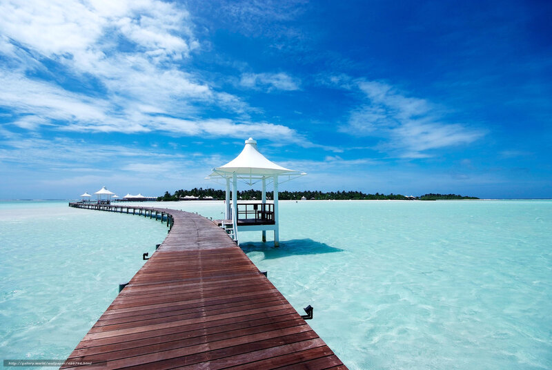 Wooden pier over turquoise water