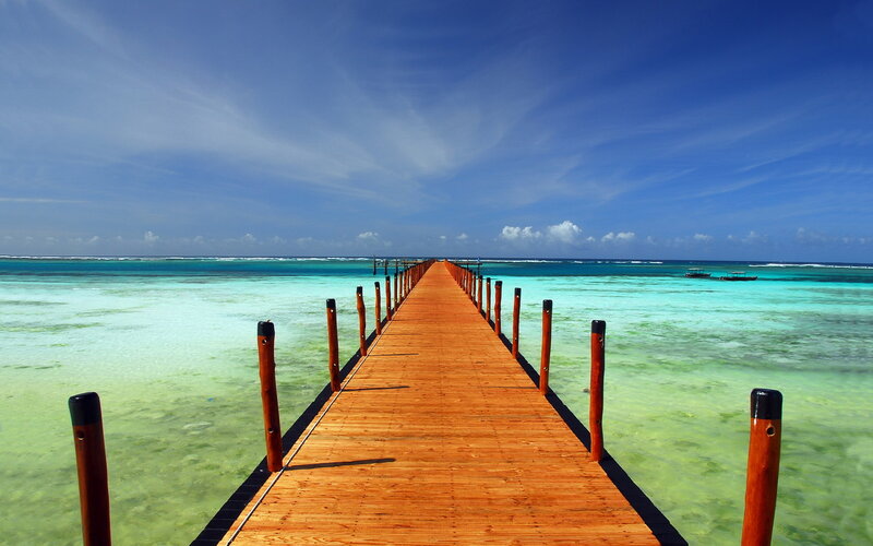 Wooden pier over turquoise water