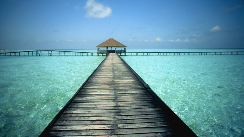 Wooden pier over turquoise water