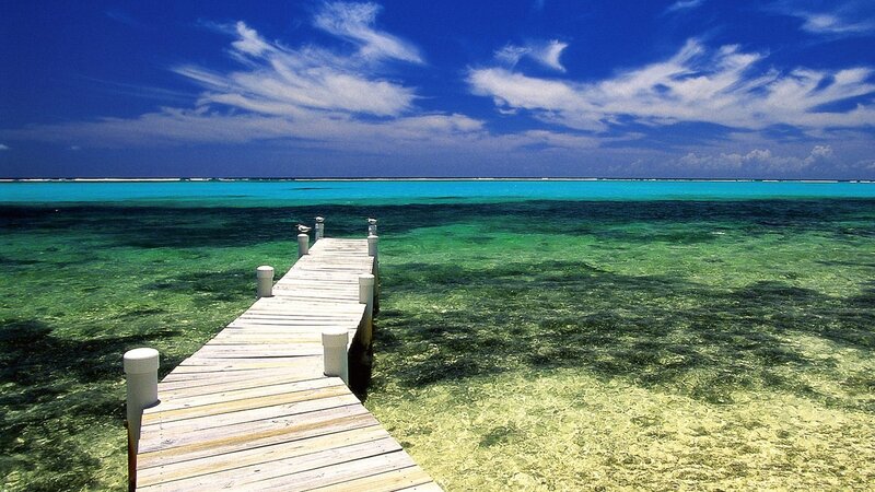 Wooden pier over turquoise water