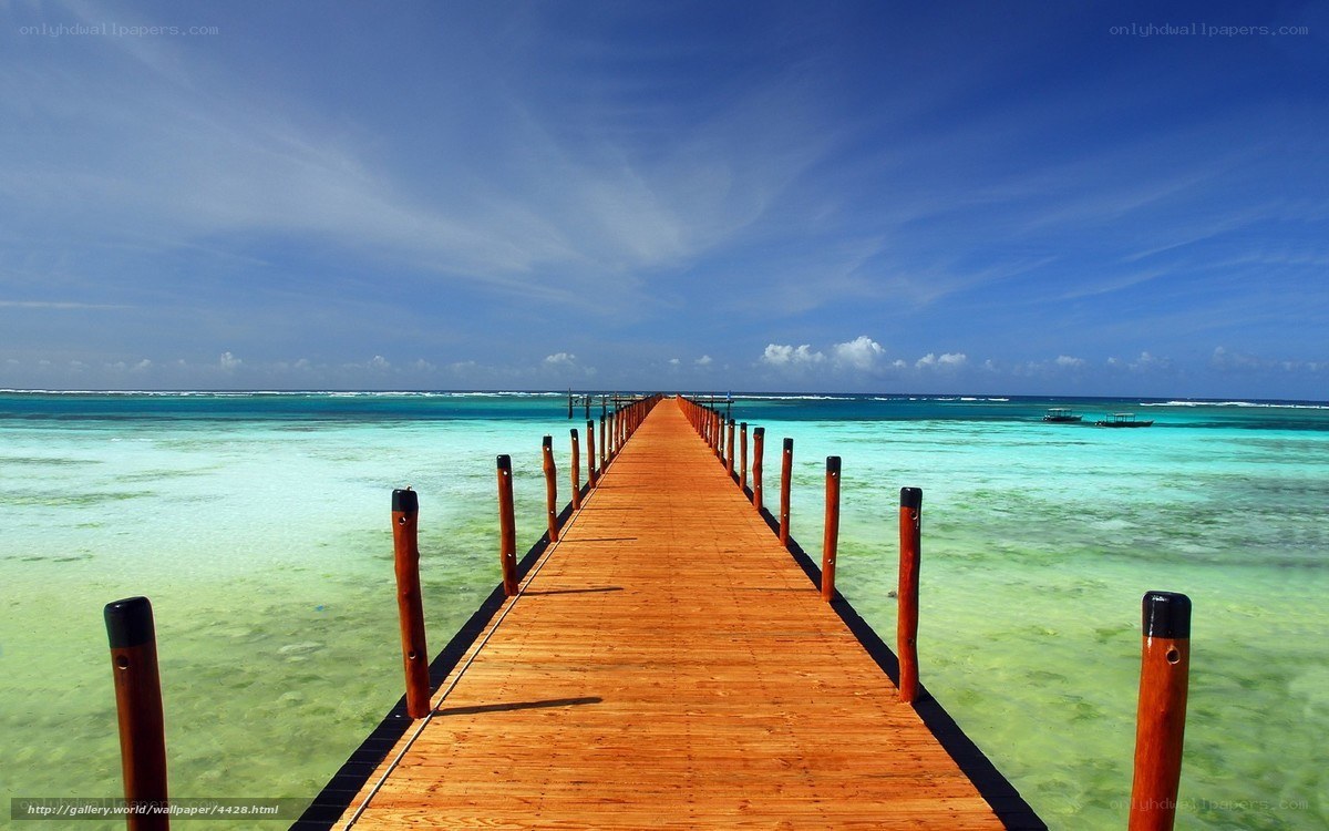 Wooden pier over turquoise water