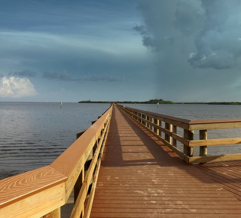 Wooden Pier over Water — Brown