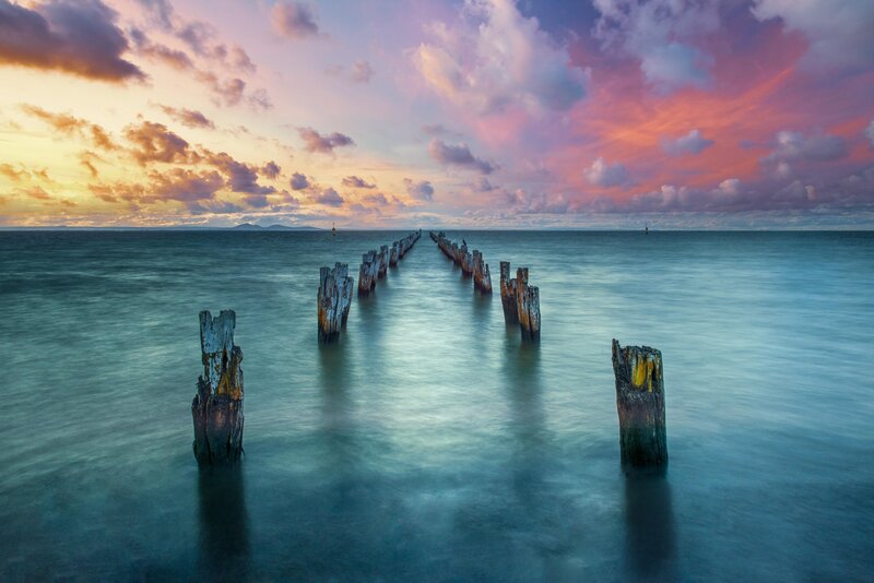 Wooden Pier Pilings — Blue, Serene, Sunset