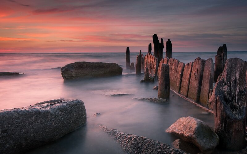 Wooden Pier Posts at Sunset