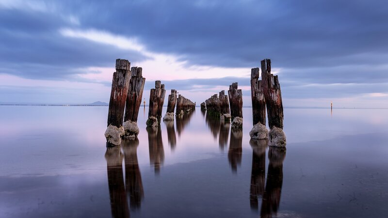 Wooden Pier Posts — Blue, Serene, Sunset, Photograph