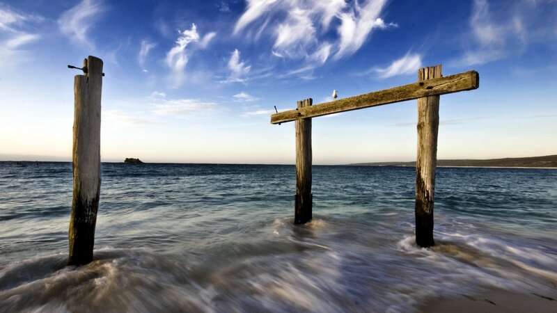 Wooden pier ruins at beach