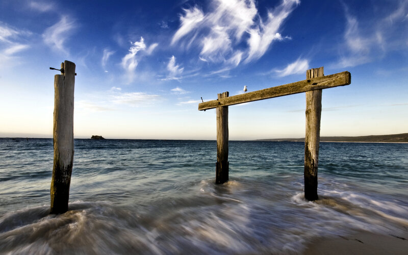 Wooden pier ruins at beach