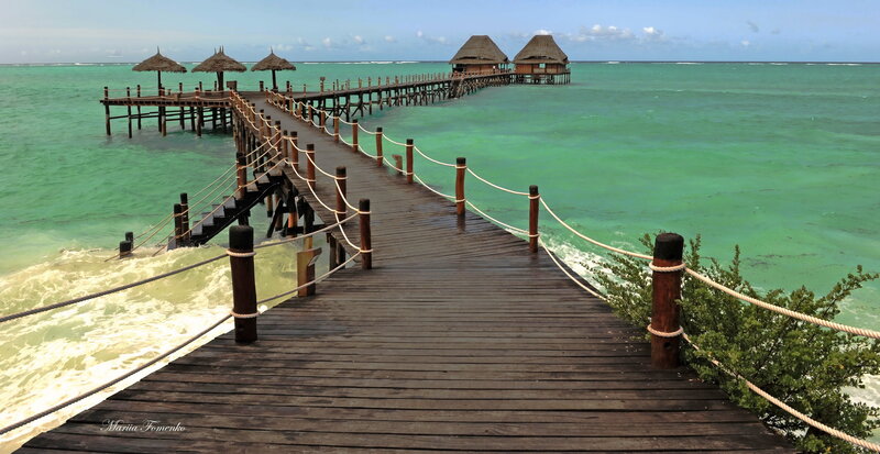 Wooden pier to ocean bungalows