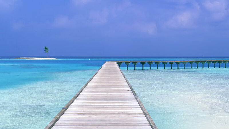 Wooden pier to tropical island
