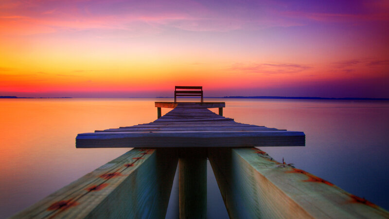 Wooden Pier with Bench — Orange, Serene, Sunset, Photograph, Water