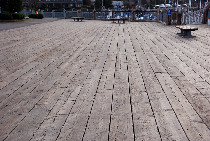 wooden pier with benches