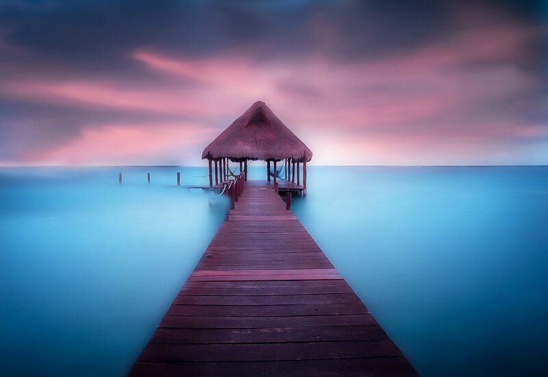 Wooden Pier with Hut — Blue, Serene, Sunset, Photograph