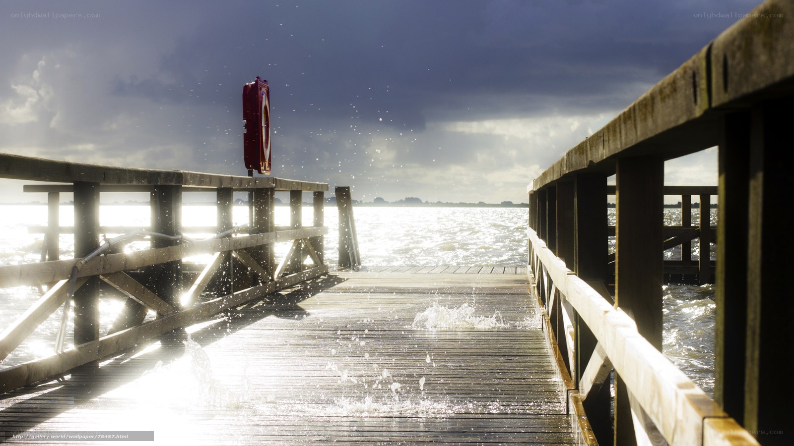 Wooden pier with splashing water